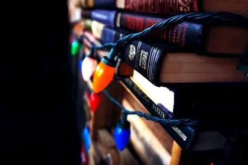  lights on a pile of books